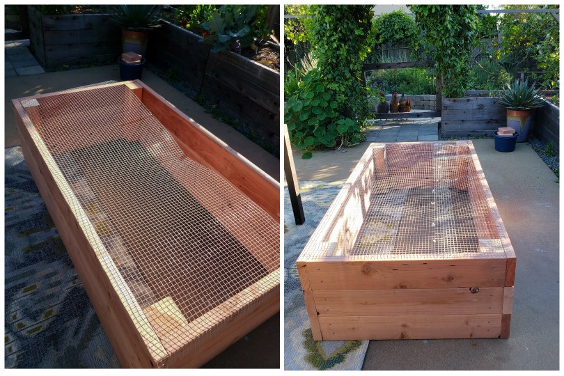 An image showing hardware cloth being attached to the underside of a garden bed. One section wasn't wide enough so another piece was added to cover it all. The bed is flipped upside down on the patio. 